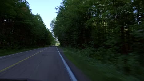 car driving through a small rural road