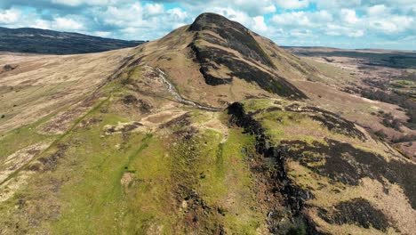 aerial pullback of scottish conic hill, near loch lomond in the scottish highlands