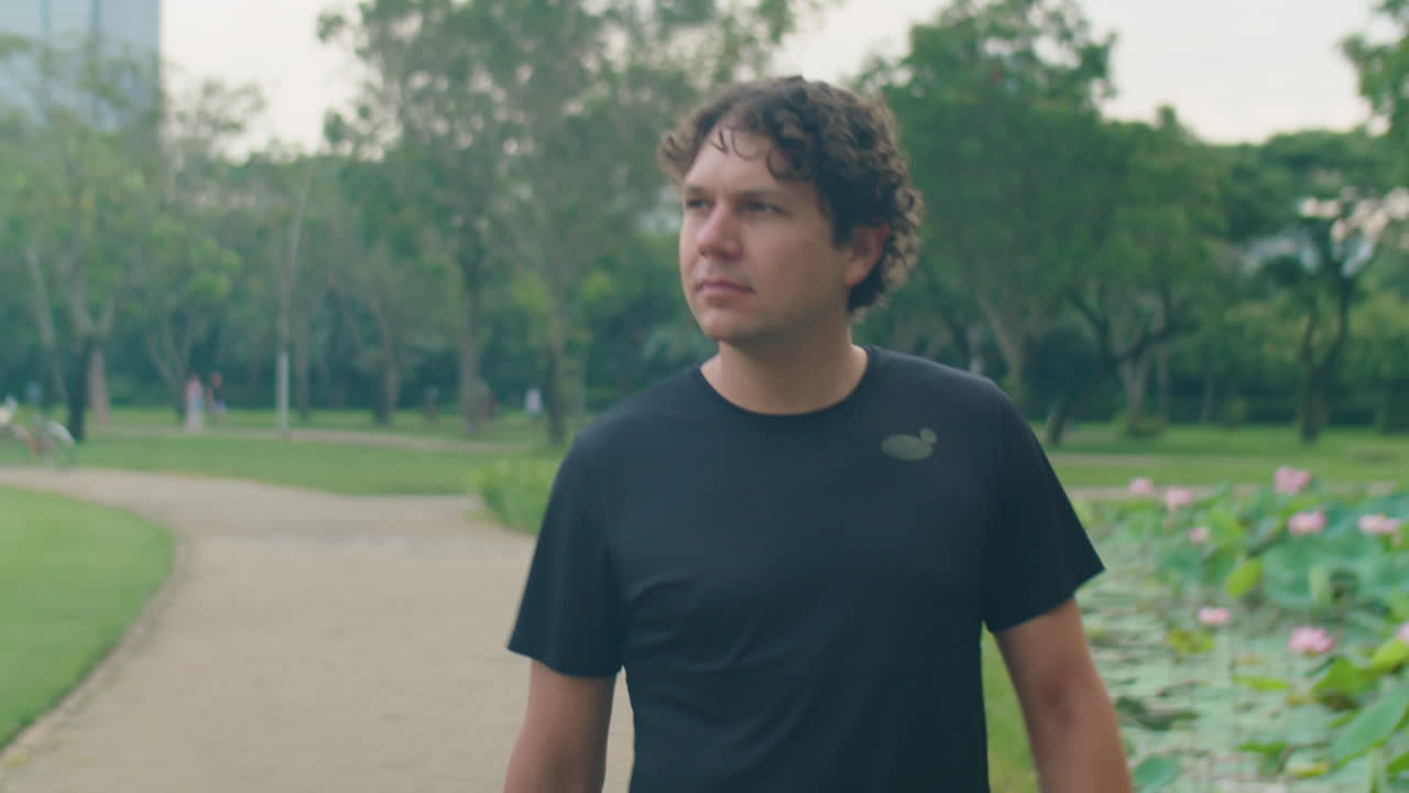 Man Walking in Park for Morning Workout