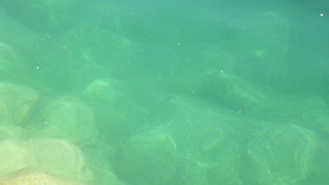 clear water with visible rocks underwater