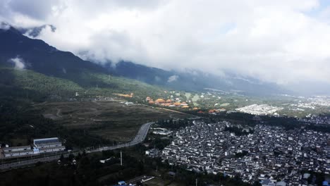 chinese dali city on cangshan mountains hillside, high aerial view