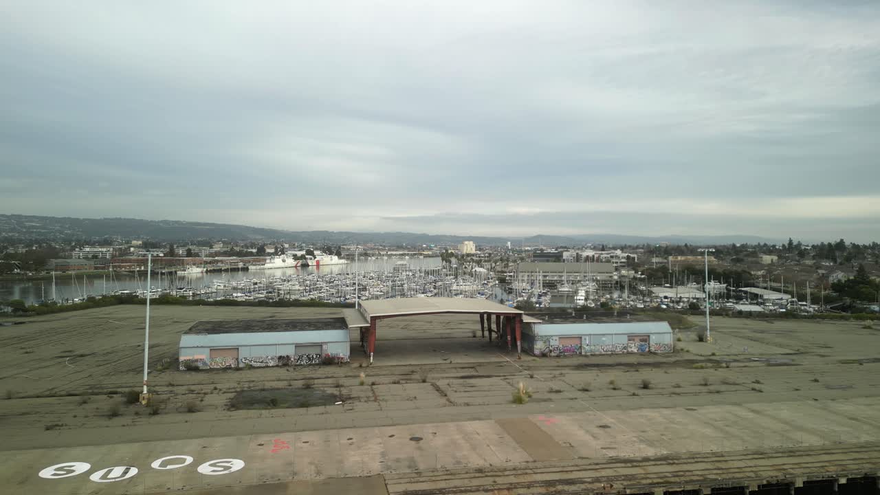 Mariner Square from above, revealing intricate dock layouts, shimmering waters, and the calm ambiance of Alameda's marina.