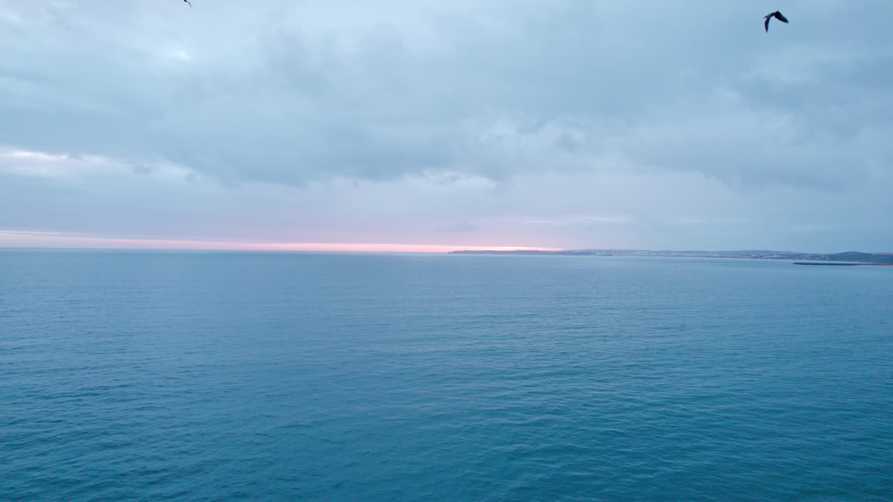 Seagulls shot of the sunset seen from Alvor's beach