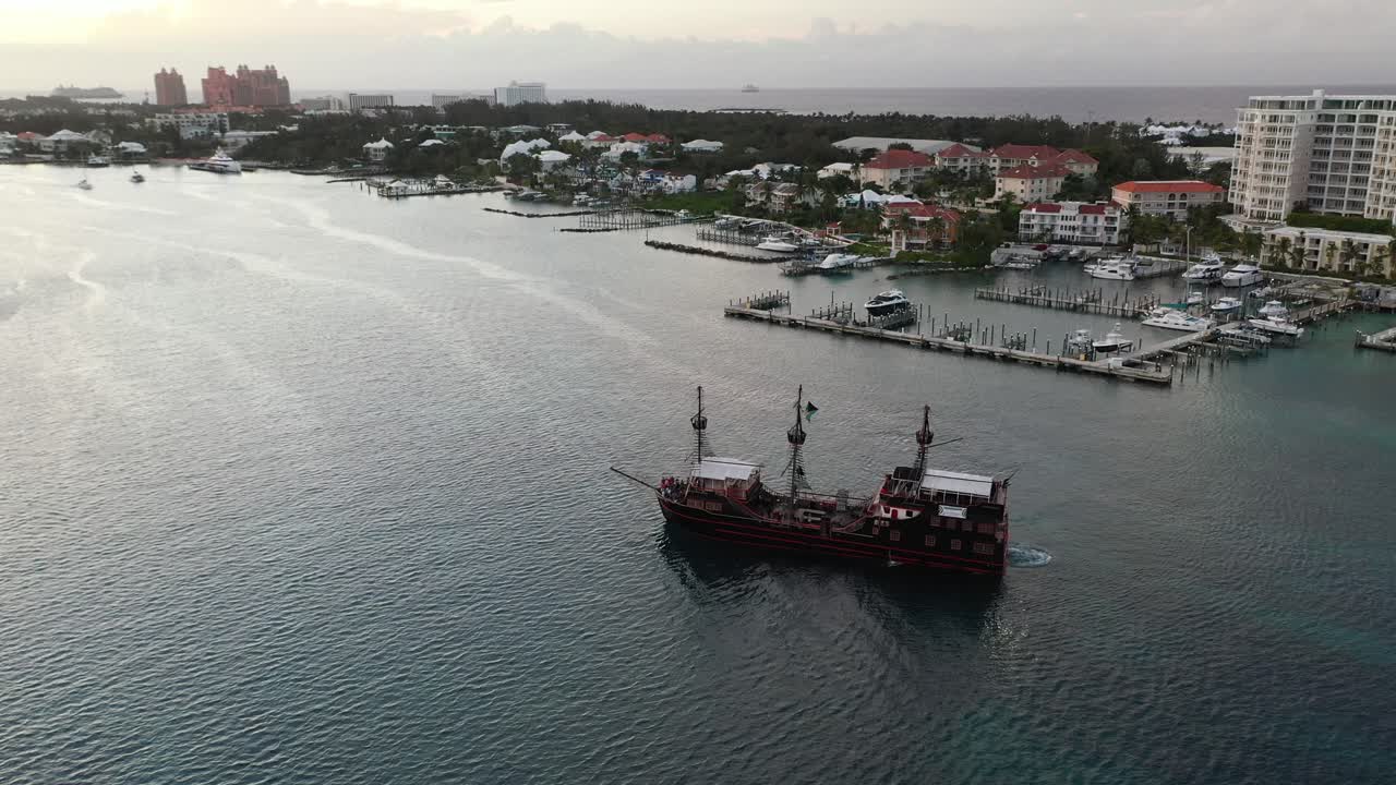 Vintage Pirate Ship Sailing by Nassau Bahamas Waterfront and Harbor, Drone Aerial View