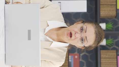 Vertical-video-of-Business-woman-looking-at-camera-with-wow-expression.