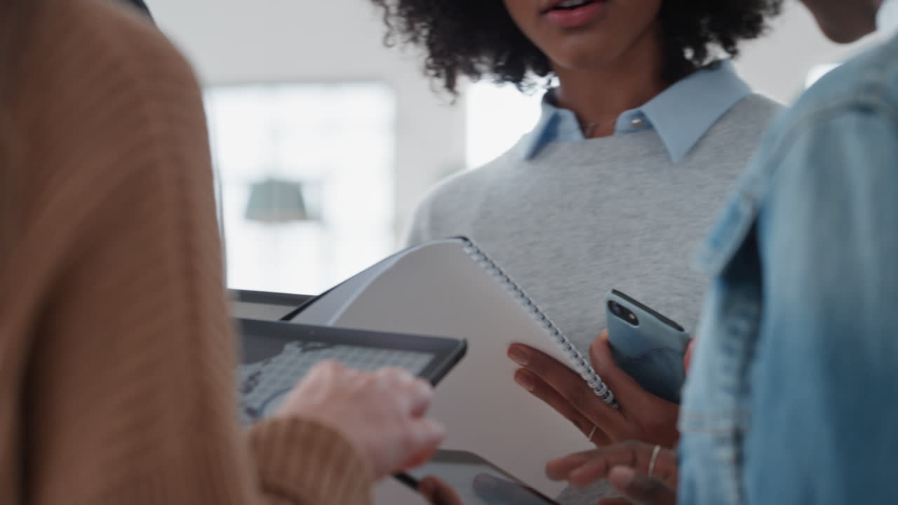 diverse business team using digital tablet computers discussing graph research data sharing ideas brainstorming in office workplace