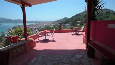 Enjoying-the-view-from-a-villa-stone-patio-of-the-beautiful-ocean-surrounded-by-cityscape