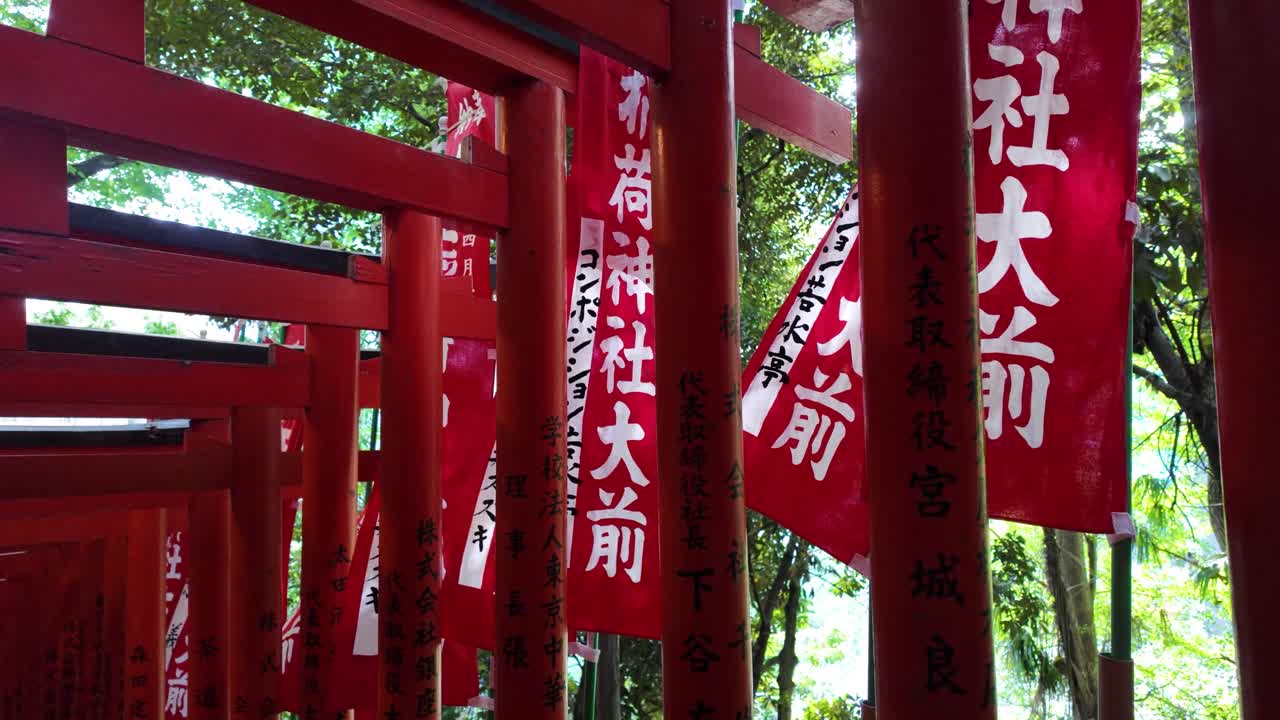 Red torii gates tunnel Hie Shinto Shrine Tokyo, Japan religious landmark