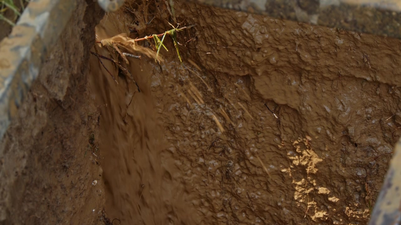 Drilling a water well in a rural area to access underground resources