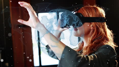 animation of rotating globe and network over woman in vr headset gesturing, using virtual interface