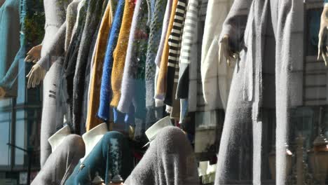 fashionable fall clothing display in a shop window