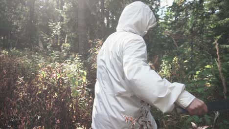 man with knife in the woods