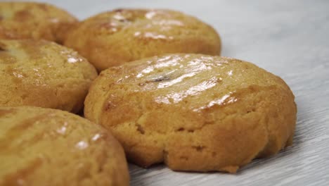 stacked round fresh shortbread cookies on a wooden surface