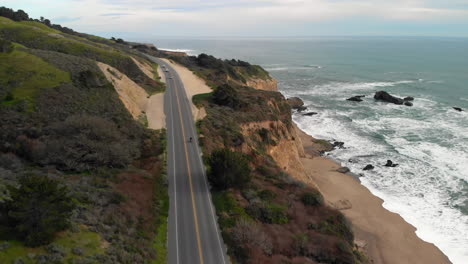 Aerial-of-Motorcyclist-Riding-on-California-Coast-Highway-One