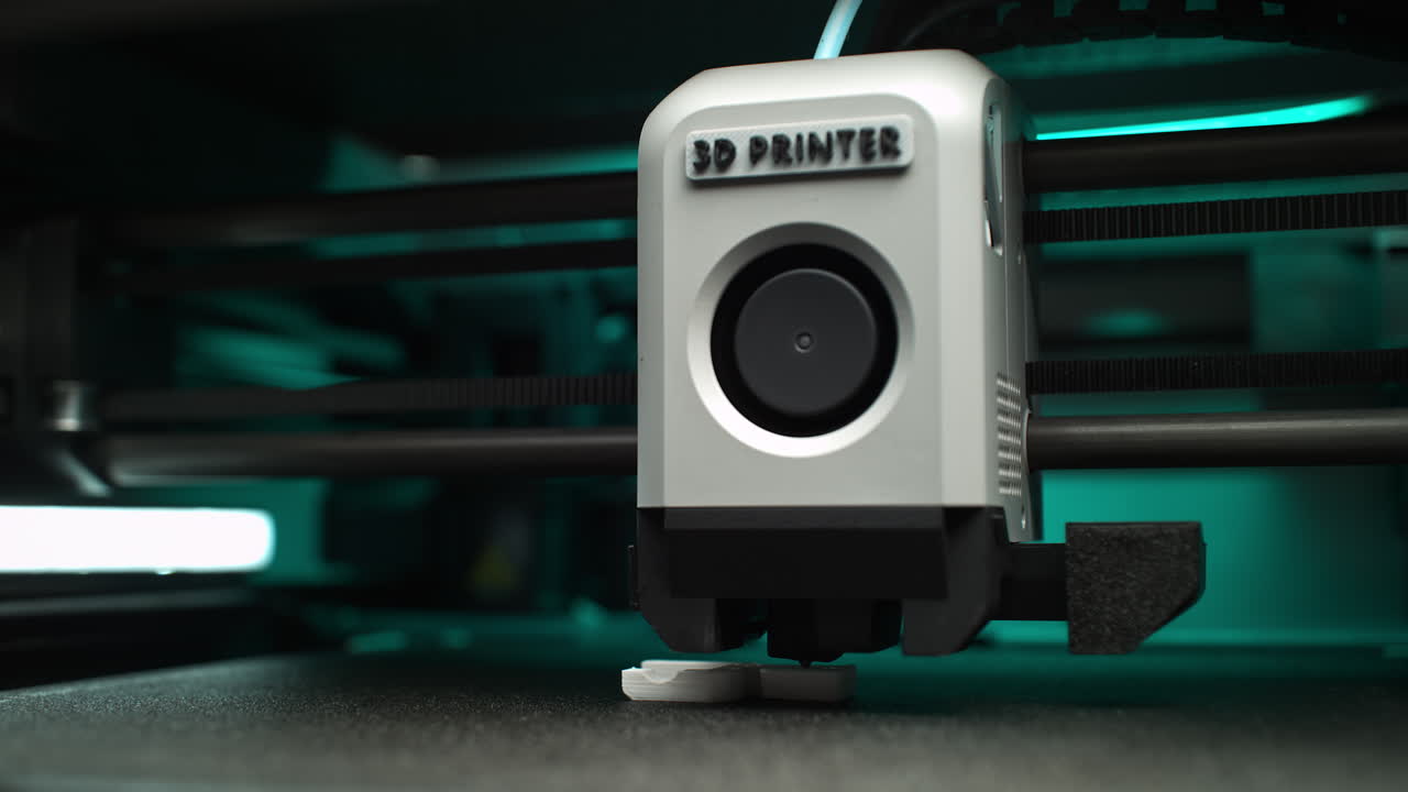 FDM 3D Printer Extruder Moves Along A Carbon Rail, Printing Layers Of The Object on a Platform in Slow Motion