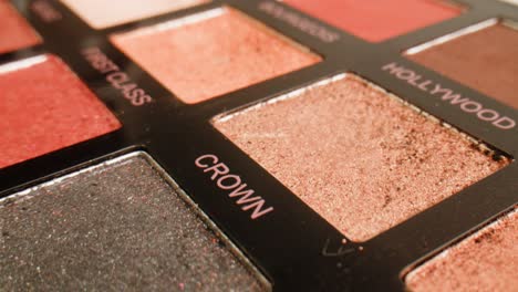 close-up of an eyeshadow palette with various shades