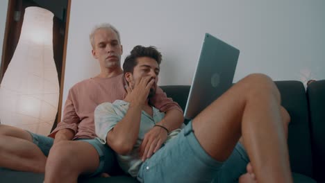 two men looking at a tablet