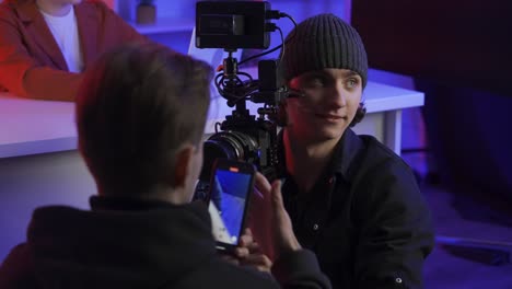 filming a video shoot in a studio environment