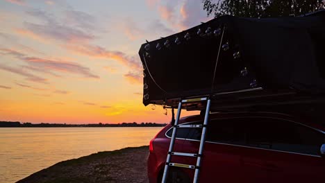 serene static time-lapse, car rooftop tent at northen europe lake sunrise