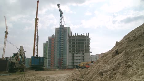 construction site with cranes and heavy machinery