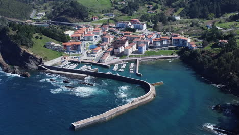 low aerial orbits quaint basque village on northern coast of spain