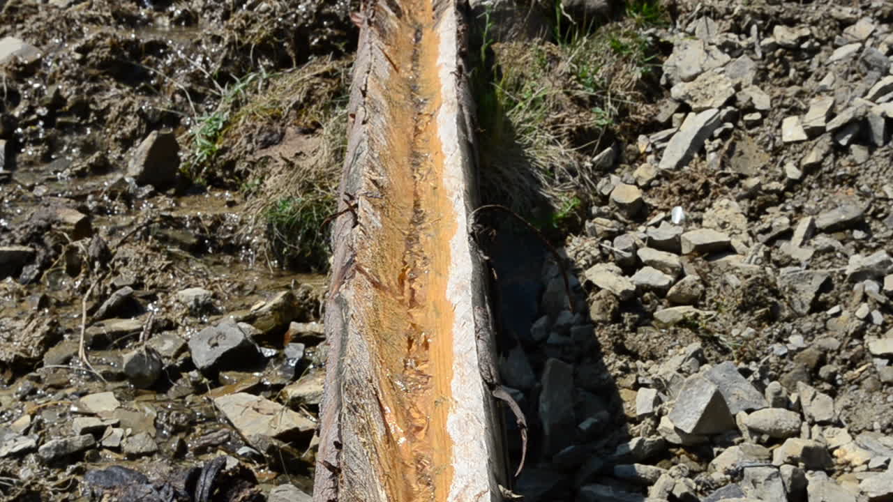 Mountain spring. Summer in mountains, a mountain spring, a construction