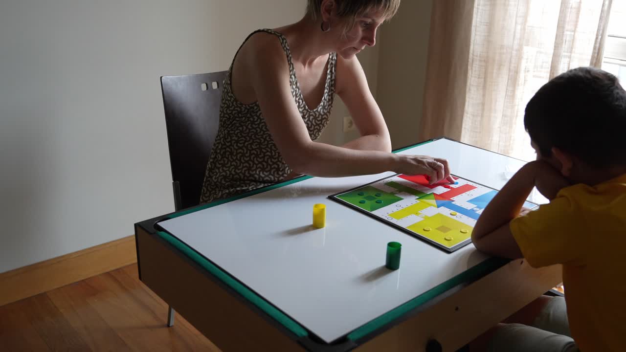 People playing a board game at a table