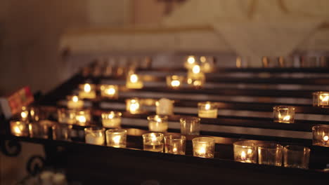 burning candles in a church