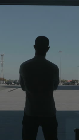 man standing in parking lot