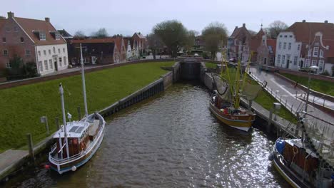 Drone-flight-over-a-tranquil-fishing-village-in-germany