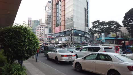 busy city street scene with traffic and pedestrians