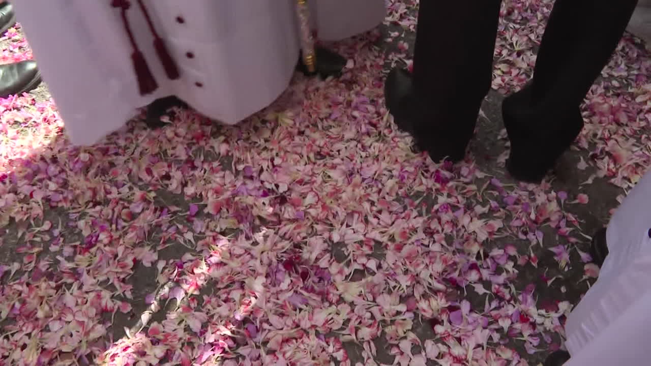 Religious ceremony with flower petals
