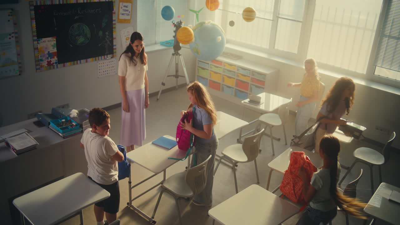 Happy Primary School Children Packing Their Backpacks and Leaving School for Holidays