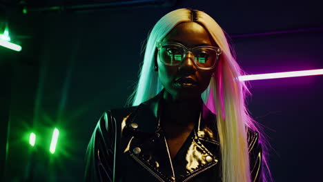 stylish woman in neon lit cyberpunk setting with blonde hair and glasses