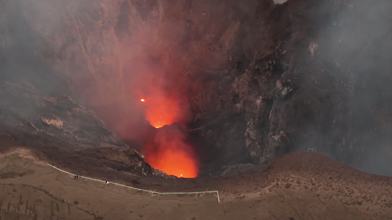 Crater rim and lava chamber in Mount Yasur, Vanuatu volcano, Tanna Island. Aerial drone
