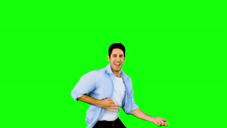 Man-playing-air-guitar-on-green-screen