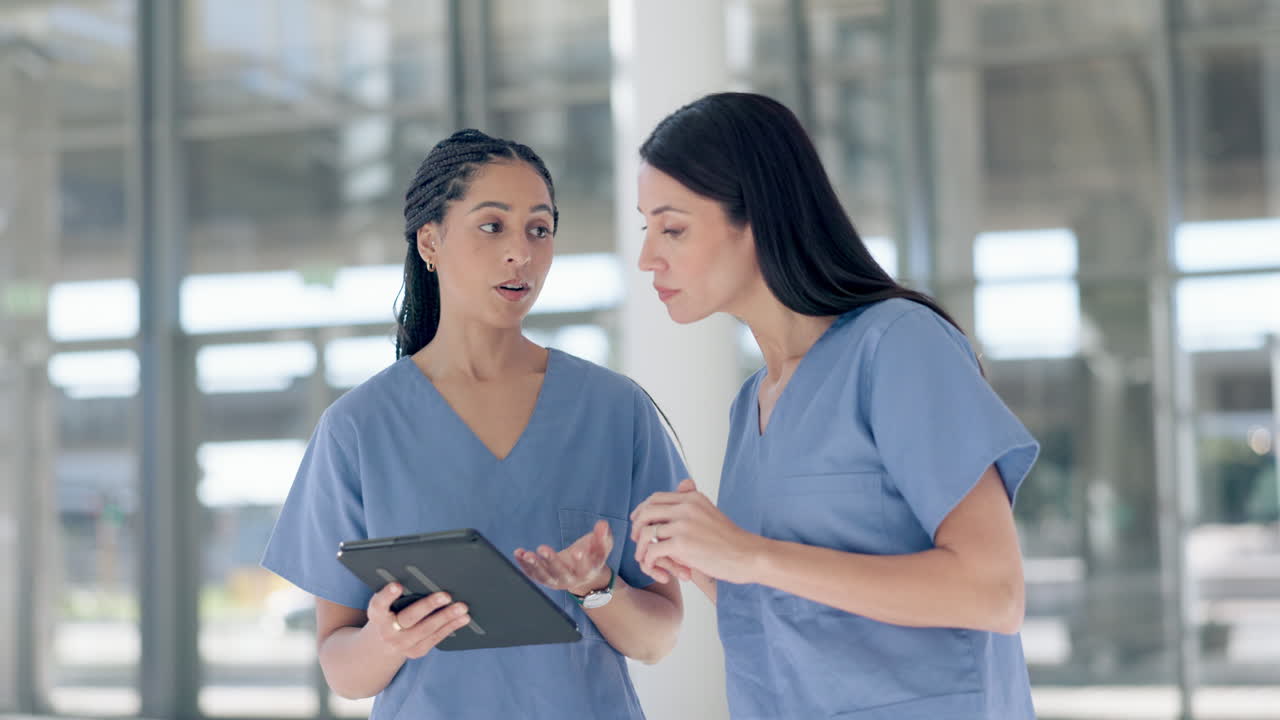Nurses, women and advice on tablet in hospital
