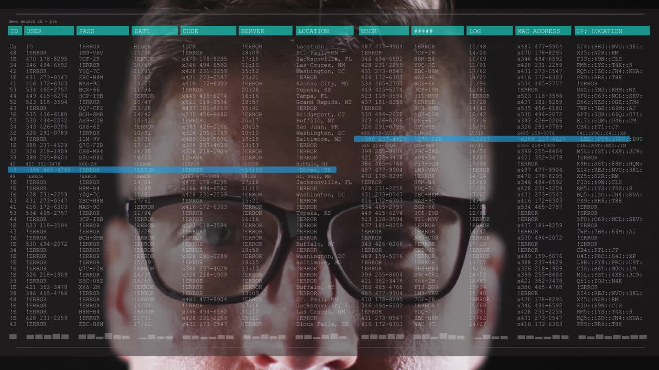 Wearing glasses, person viewing animation of computer code and data on screen