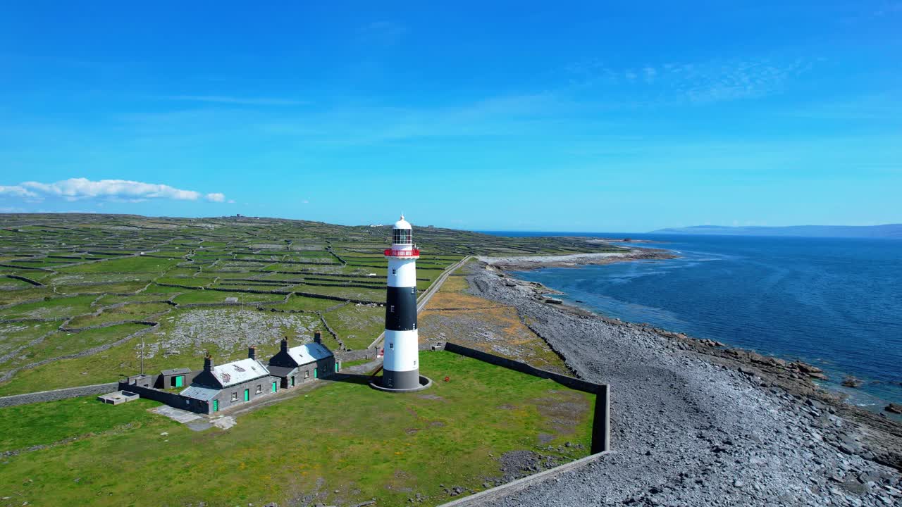 Drone flying past lighthouse on Inisheer Aran Islands Wild Atlantic Way Ireland