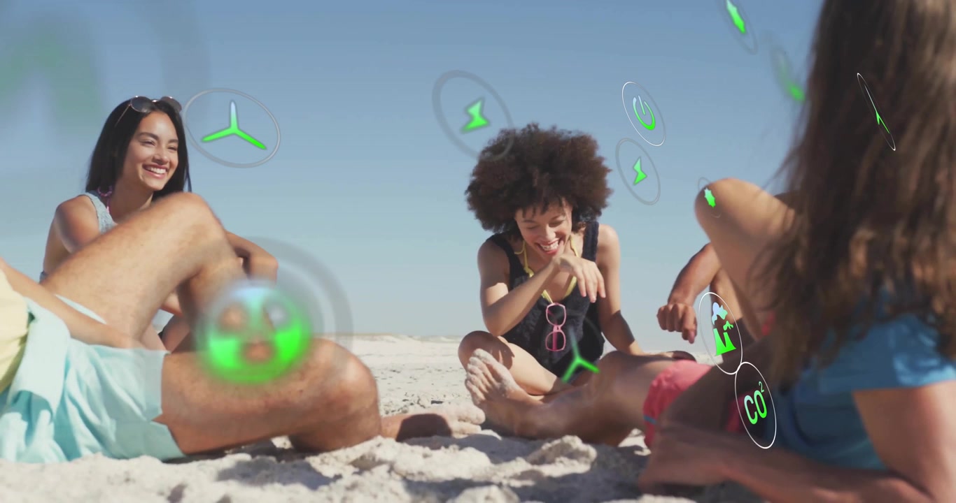 Friends settling on sunny beach noticing drifting green energy icons illustrating tech and laughing