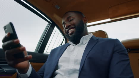 african man making video call in the car