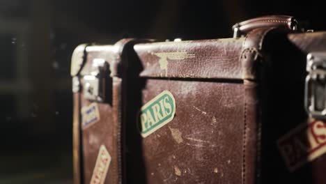 a vintage suitcase with travel stickers from paris: capturing the essence of adventure and nostalgia in a timeless moment