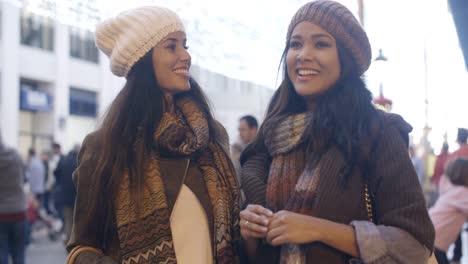 two women chatting in a street in winter