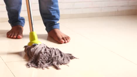 man mopping floor