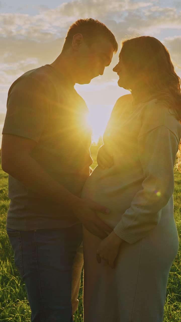 Pregnant Couple at Sunset