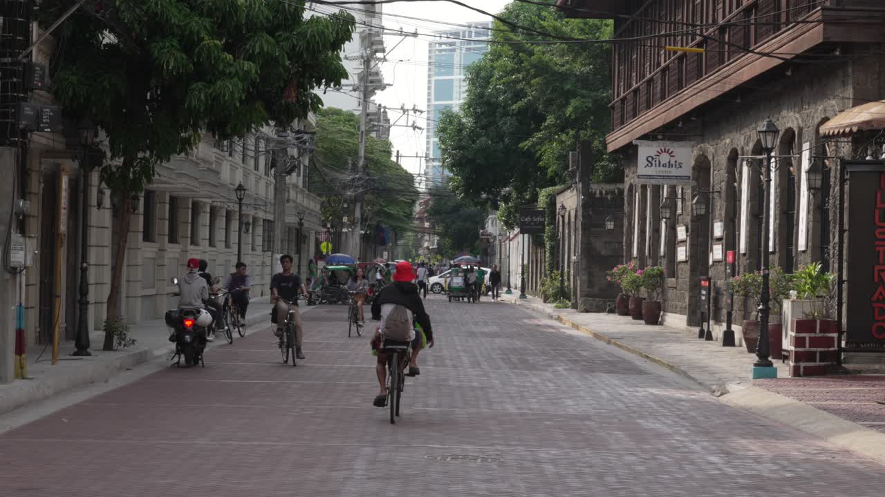 Bike street Manila Philippines Intramuros Spain colonial era buildings paved road
