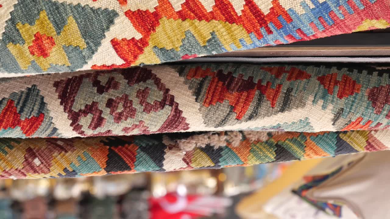 Stack of Colorful Woven Rugs
