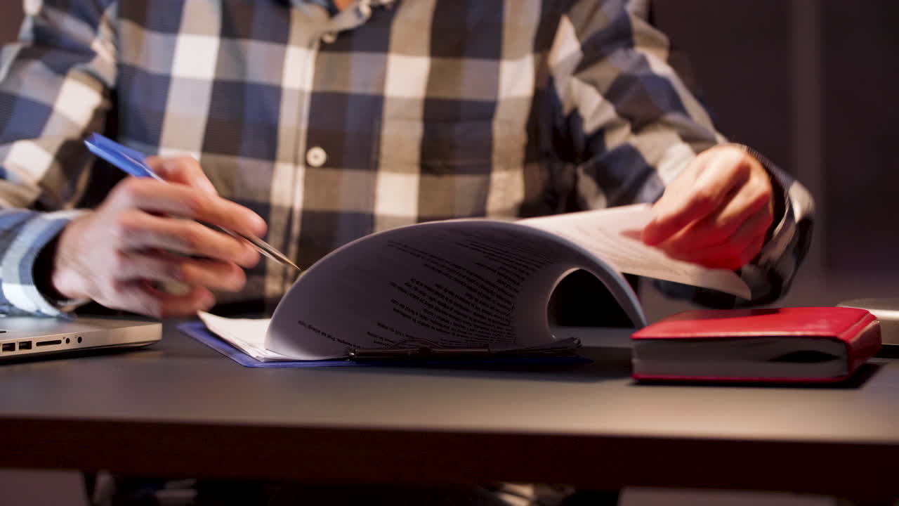 Man reviewing documents at desk