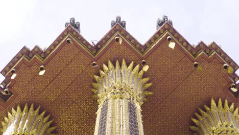 golden bells under the roof of pantheon in wat phra kaew, bangkok, thailand