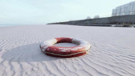 lifebuoy on the city beach at sunset